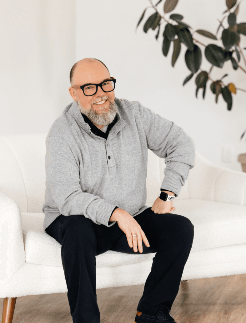 Executive Director sitting on a couch.