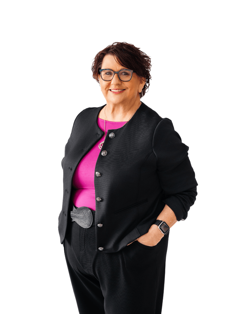 Woman standing in front of a white background.